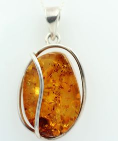 amber pendant This gorgeous amber pendant was made of high-quality 925 sterling silver. The pendant is approx. 4.8 cm with the eyelet and without the eyelet a size of approx. 3.3 x 2.2 with a weight of approx. 14.7 g. A really beautiful piece of amber. It has been hand-framed in a beautiful setting Type: pendant Material: 925 sterling silver Gemstone: amber 3.3 x 2.2 cm Length: about 4.8 cm Thickness: about 1.6 cm Weight: approx. 14.7 g On the additional pictures you can guess the beauty of this Teardrop Baltic Amber Necklace In Amber Color, Baltic Amber Necklace With Round Pendant, Baltic Amber Round Pendant Necklace, Round Pendant Baltic Amber Necklace, Round Baltic Amber Pendant Necklace, Amber Jewelry Necklaces, Artisan Amber Oval Necklace, Teardrop Baltic Amber Necklace, Oval Baltic Amber Necklace