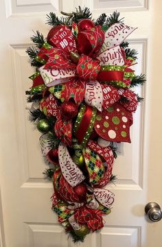 a christmas wreath hanging on the front door