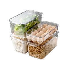 three containers with food in them are stacked on top of each other, one containing eggs and the other containing vegetables