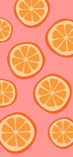 orange slices are arranged on a pink background