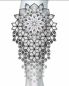 an intricate white vase with black and white designs on the bottom, in front of a white background