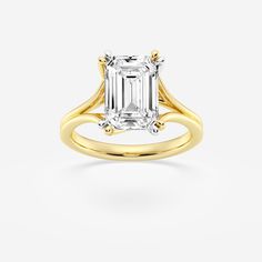 a yellow gold engagement ring with an emerald cut diamond in the center and two shoulders