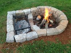 an outdoor fire pit made out of rocks