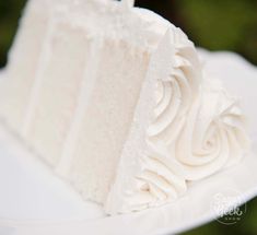 a piece of white cake sitting on top of a plate