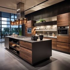 a modern kitchen with wooden cabinets and stainless steel appliances, along with an island in the middle