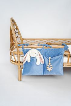 a baby crib with a stuffed animal in it