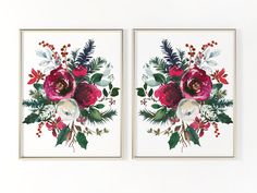 two floral paintings are hanging on the wall