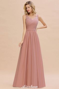 a woman wearing a long pink bridesmaid dress in front of a beige background