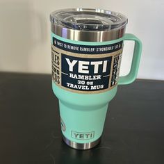 the yeti rambler cup is sitting on a table