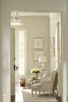 a living room filled with furniture and white walls