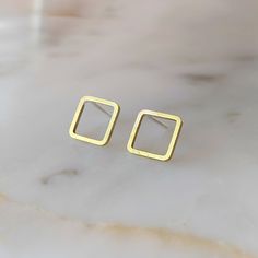 "Add some simple elegance to your day! These square stud earrings are the perfect addition to any outfit. Whether it's to a ball game, a date, or the gym, try these earrings on to add a touch of elegance that is at the same time, minimal and understated. They're perfect to pair with a statement necklace, when most earrings would be too much. We use solid brass squares and solder a solid .935 silver post onto them so they hang in a diamond shape. ● Metal: Solid brass with solid .935 silver posts Square Hypoallergenic Earrings For Gift, Hypoallergenic Square Earrings For Gifting, Hypoallergenic Square Earrings As Gift, Hypoallergenic Square Earrings For Gifts, Square Nickel-free Earrings For Everyday, Nickel-free Square Earrings For Everyday Wear, Nickel-free Square Minimalist Earrings, Minimalist Square Nickel-free Earrings, Everyday Square Nickel-free Earrings