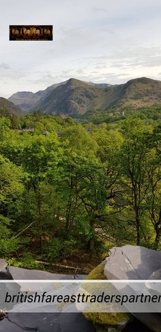 the mountains are covered in green trees and rocks, with text overlaying them