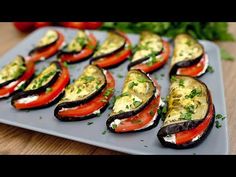 sliced eggplant and tomatoes on a plate with parsley