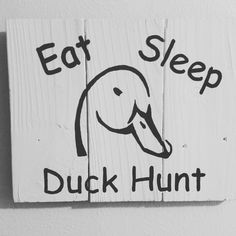 a sign that says eat sleep duck hunt