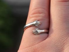 "Copy and paste into your browser, get 15% off ➔ https://bit.ly/VD15OFF This hug ring makes a perfect gift for friends and couples. Crafted from stainless steel, it's a meaningful symbol of your bond. A truly special promise ring, it's perfect for celebrating love, friendship, and commitment. DETAILS: -One Ring -Ring is Stainless Steel -18mm from top of one hand to bottom of the other -4mm wide You will receive one hug ring. **Every item is handmade, this means that each will be unique and may not look EXACTLY like the picture, but it will look very similar ➡ORDER PROBLEMS If there are any problems with your order please contact me, my goal is for you to be happy with your products and I will do what I can to help! ➡BULK ORDERS I gladly make bulk orders! For every bulk order of 15+, there Gifts For Long Distance Friends, Couples Long Distance, Hug Ring, Long Distance Friends, Distance Friendship, Best Friend Birthday Gift, Long Distance Friendship, Friendship Ring, Promise Rings For Couples