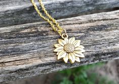 This cute, detailed sunflower necklace would make a great gift. The sunflower comes in gold or silver. The flower measures 3/4 inch and you can choose the length of the necklace. This would make a great gift for a birthday, an anniversary, Christmas or any other occasion. All jewelry items come in a gift box. Sunflower Necklace, Memory Locket, Gift For Wedding, The Sunflower, Metal Pendant, How To Make Paper, Wedding Bridesmaids, Locket, Paper Flowers