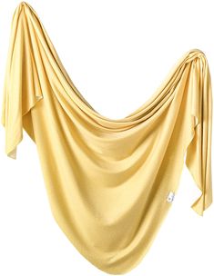 a yellow cloth draped over a white background