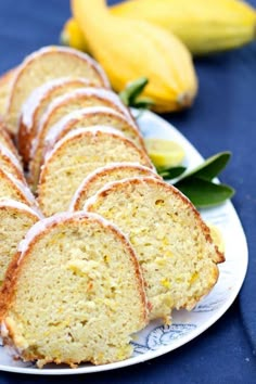 a white plate topped with slices of banana bread