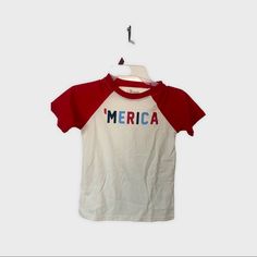 New Boys ‘ Merica Off White And Red T-Shirt Size 6 Red Tops With American Flag Print For Spring, American Red T-shirt With Graphic Print, Red Patriotic Shirt With Letter Print, Red Patriotic Letter Print Shirt, Patriotic Red Shirt For Spring, Patriotic Red Short Sleeve Tops, American Style Red T-shirt With Letter Print, Red Patriotic Short Sleeve Tops, Red Graphic Print Tops For 4th Of July