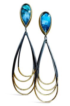 Gold & Silver Earrings - These striking earrings are crafted with lightweight materials and add flair and excitement to any outfit. Featuring rose-cut teal kyanite stones in a smokey deep blue hue with natural dark flecks, they are secured with sterling silver post backs. Each teardrop dangles freely, adding dynamic movement. Dynamic Movement, Artful Home, Blue Hues, Rose Cut, Deep Blue, Jewelry Art, Silver Gold, Silver Earrings, Austin