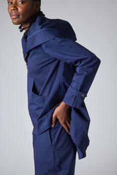 This swing jacket is the perfect outerwear piece for cool spring/summer nights or rainy days. Pair with the matching Twill Wide-ish Pants for a chic but casual look. Hooded Tapered Hemline Zips Up Loose Boxy Fit 2 Front Pockets FINAL SALE Blue Spring Outerwear With Side Pockets, Blue Relaxed Fit Outerwear With Side Pockets, Navy Cotton Outerwear With Button Cuffs, Cotton Raincoat With Pockets For Rainy Weather, Blue Workwear Outerwear With Side Pockets, Blue Outerwear With Side Pockets For Work, Casual Fall Raincoat For Workwear, Casual Fall Workwear Raincoat, Blue Utility Outerwear With Side Pockets