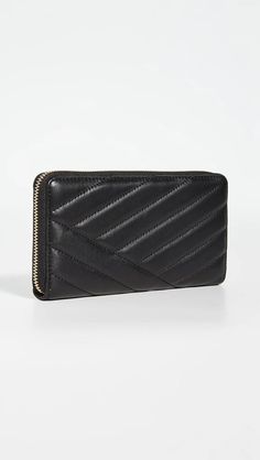 Add effortless style to your everyday with the luxurious Kira Chevron Zip Continental Wallet. Crafted from buttery soft lambskin leather with subtle quilting details, this durable yet stylish wallet features interior pockets and compartments to keep you organized on the go. Accented with signature gold-tone zipper and hardware, it carries all the essentials in one elegant package. At under 5 inches, its slim design fits discreetly in handbags without added bulk. Imported leather ensures quality Luxury Rectangular Wallet With Zipper Closure, Luxury Rectangular Wallets With Zipper Closure, Luxury Evening Wallet With Zipper Closure, Designer Evening Wallet With Zipper Closure, Elegant Leather Wallet With Zipper Closure, Classic Formal Wallet With Zipper Closure, Elegant Bifold Wallets With Zipper Closure, Chic Travel Wallets With Zipper Closure, Elegant Bifold Wallet With Zipper Closure