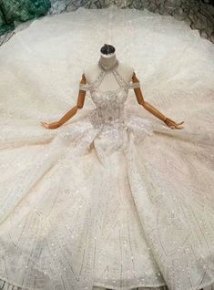 a mannequin dressed in a wedding dress on display