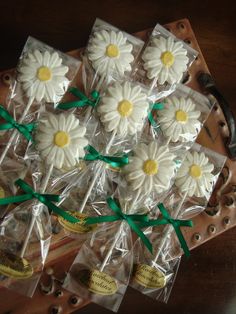 small white flowers wrapped in cellophane and tied with green ribbon