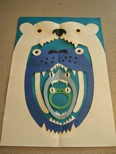 an image of a paper cut out of a bear with its mouth open and teeth missing