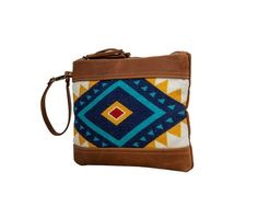 Always upbeat, this pouch bag features a wonderful palette of colors. Leather in warm tones of rich caramel bracket the upcycled woven rug with its cheerful hues of blue, sunrise yellow and white. The back is a warm caramel woven canvas. Just the right size when youÕre on the go. Zipper-close top and leather wristlet strap. Brown Woven Travel Pouch, Travel Woven Brown Pouch, Travel Brown Woven Pouch, Brown Handwoven Pouch For Everyday Use, Brown Handwoven Pouch, Multicolor Woven Pouch For Everyday Use, Bohemian Woven Travel Pouch, Blue Sunrise, Leather Wristlet