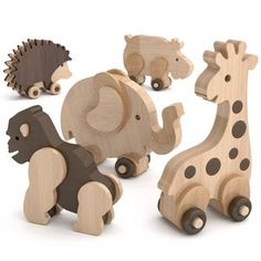 various wooden toy animals are shown on a white background