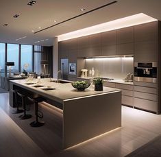 a modern kitchen with an island and large windows