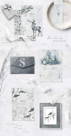 the wedding stationery is laid out on top of each other, including cards and envelopes