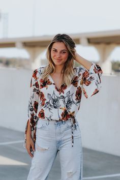 Long bell sleeve V-neck floral print blouse.Abi is wearing a size smallLightweight blendThis item is final sale. Chic Floral Print V-neck Top, Flowy V-neck Blouse With Floral Print, Chic V-neck Floral Print Top, Trendy Floral Print V-neck Blouse, Trendy V-neck Blouse With Floral Print, Spring Floral Print V-neck Blouse, Trendy Floral Print V-neck Tops, Chic Bell Sleeve Vacation Blouse, Chic Bell Sleeve Blouse For Vacation