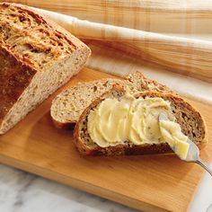 a loaf of bread with butter spread on it