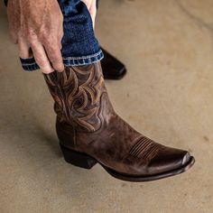 Experience the bold and timeless style of the Andrews cowboy boot for men. Crafted with rich chocolate brown leather and intricate tonal embroidery, this classic boot will elevate any look. Whether you're out on the ranch or hitting the town, the Andrews boot is the perfect combination of rugged and refined. Height: 11" Men's Leather Boots, Boot For Men, Tonal Embroidery, Western Style Boots, Wedding Boots, Summer Boots, Buy List, Mens Cowboy, Mens Cowboy Boots