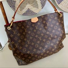 This Beautiful Louis Vuitton Graceful Mm Bag ( Purse) Is Like New And Has Only Been Carried A Couple Of Times. I Decided It Is Too Large For Me. It Is Absolutely Gorgeous And In Excellent Condition. This Bag Has Been Sold Out On The Louis Vuitton Website. The Bag Was Purchased From The Louis Vuitton Website On August 27, 2018 And Is 100% Authentic. See Picture Of Receipt And Authentication. Please Message Me With Any Questions. Louis Vuitton Dust Bag Is Included. Comes From Smoke Free Home. Features: Pivoine Pink ( Peony Pink) Interior Monogram Coated Canvas Natural Cowhide-Leather Trim Textile Lining Gold-Color Hardware Leather Tab Magnetic Closure Name Tag Zipped Inside Pocket 1 Everyday Luxury Signature Coated Canvas Shoulder Bag, Large Capacity Bags In Signature Coated Canvas, Louis Vuitton Graceful Mm, Louis Vuitton Graceful, Louis Vuitton Dust Bag, Peony Pink, Classic Monogram, Bags Louis Vuitton, August 27