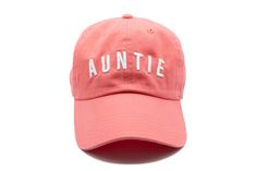 Our newly arrived auntie hat - just for you! You can even add custom embroidery to the back for a look that is sure to set you apart from the crowd. Features: 100% cotton Adjustable back closure Mama letters are embroidered Make It Yours We are now offering the option of customized embroidery on your Letter Hat. Add up to 10 characters of text on the back of the hat, centered above the ponytail holder. Cotton Trucker Hat With Letter Print Visor, Aunt Hat, Pink Trucker Hat With Embroidered Logo, Pink Trucker Hat For Sports, One Size, Personalized Summer Trucker Hat, One Size, Ponytail Holder, Ponytail Holders, Custom Embroidery, The Cool