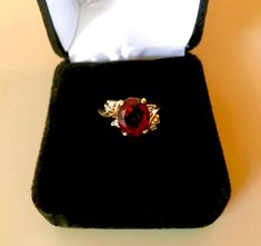 14K YELLOW GOLD, Vintage ring of solid gold, set with an oval facet garnet (3.20ct) accented with six 0.09ctw of fine full cut round brilliant (SI, H-I) diamonds. Item: Garnet and Diamond Ring Gemstones: Garnet (natural, oval facet); Diamonds (natural, full cut round brilliant) Approx. Measurement or Weight of Gem Stones: Garnet: 10.0mm x 8.15mm x 4.9mm (3.20ct); Diamonds: 6 @ 1.5mm (0.09ctw) Color: H-I Clarity: SI Mounting metal: 14K Yellow Gold Approx. Size or length: Size 5.5, band is 1.9mm w Gold Ruby Gemstones For Anniversary, Oval Ruby Ring With Brilliant Cut For Gift, Oval Ruby Ring With Brilliant Cut As Gift, Elegant Pear-shaped Yellow Gold Birthstone Ring, Hallmarked Oval Diamond Gemstones, Fine Jewelry Pear-shaped Yellow Gold Birthstone Ring, Oval Ruby Jewelry With Brilliant Cut, Oval Diamond Ring Gift, Yellow Gold Pear-shaped Birthstone Ring