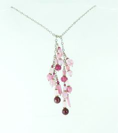 Vintage Czech glass beads in all shades of pinks and rose pair with modern Czech glass beads.  These beads are a mix of molded glass and handmade glass beads.  Each has its own details and together they are a great one of a kind necklace.  A touch of Swarovski crystal gives just the right amount of sparkle.  Each pink bead set dangles from sterling silver chain that can be worn looped high or low.  This necklace has no clasp.  Instead one end is looped over the other in a half knot or however yo Pink Elegant Dangle Beaded Necklaces, Pink Beaded Dangle Necklace, Pink Czech Glass Jewelry For Party, Pink Dangle Beaded Necklace, Handmade Pink Lariat Jewelry, Pink Glass Jewelry For Jewelry Making, Pink Glass Beaded Necklaces For Gift, Pink Adjustable Lariat Necklace For Gift, Pink Glass Beaded Necklace For Gift