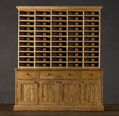 a large wooden cabinet filled with lots of bottles