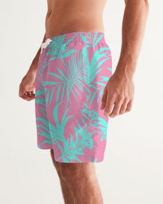 Men's Swimsuit, Tropical Foliage Pink and Teal Blue Pink and Teal Tropical Floral Leaf swim trunks. Bright turquoise blue and vibrant pink tropical foliage print Product Details Head to the beach in our classic fit Men's Swim Trunks made with comfort in mind. With an adjustable drawstring waistband, its smooth and durable materials made with UPF 50+ gives you premium UV protection. Soft, lightweight fabric Drawstring waistband UPF 50+ Built-in mesh brief Two side, one back slip pocket Printed, c Cheap Pink Short Swim Trunks, Pink Swim Trunks For Beach Vacation, Pink Swim Trunks For Beach Season Vacation, Pink Beachwear Swim Trunks For Vacation, Tropical Swim Trunks For Summer, Pink Beachwear Shorts For Beach Party, Hawaiian Style Swim Trunks For Beach Party, Pink Hibiscus Print Swimwear For Summer, Tropical Style Swim Trunks With Tropical Print For Vacation