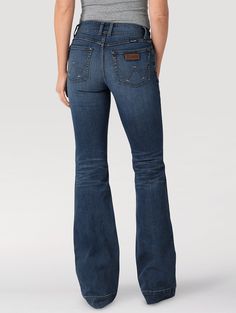 THE TROUSER: THE ULTIMATE IN WOMEN'S RETRO® JEANS Like all Wrangler Retro® jeans, our Mae wide leg is marked by its Western authenticity, making it a go-to style for cowgirls everywhere. With its contour waist and mid rise, these women's trouser jeans are made to fit comfortably while they flatter. Want the look of a flare with added comfort? Our women's wide leg jeans make it happen. With more room at the knee and a gradual opening down the leg, the Mae wide leg gives you the room you need to s Western Items, Wrangler Jeans Women's, Womens Trouser Jeans, Country Jeans, Cowgirl Jeans, Riding Jeans, Western Clothing, Retro Jeans, Jeans Models