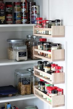 an organized pantry with lots of food in it