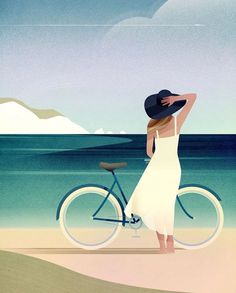 a woman in a white dress and hat standing next to a bike on the beach