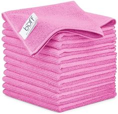 pink towels stacked on top of each other with a tag that says dolft