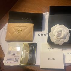 Elevate Your Style With This Timeless Classic Chanel Card Wallet. Crafted In Italy With High-Quality Caviar Leather, This Wallet Features A Solid Pattern In A Chic Beige Color. The Quilted Design And Iconic Chanel Logo Add A Touch Of Luxury To This Piece, While The Champagne Goldtone Hardware Perfectly Complements The Design. This Card Wallet Is Perfect For Both Men And Women, With Features Including Credit Card Slots And Folding Capabilities. Whether You're Using It For Everyday Use Or Special Chanel Card Holder Beige, Champagne Hardware, Envelope Paper, Beige Champagne, Classic Chanel, Classic Card, Chanel Logo, Solid Pattern, Classic Elegance