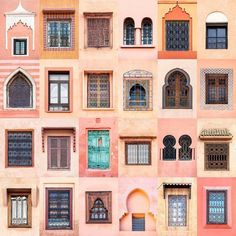 many different windows and shutters on the side of a building