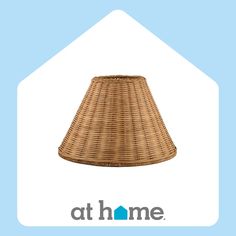 a wicker lamp shade with the words athome on it's side