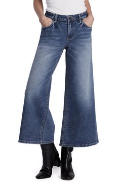 Dramatically cropped wide-leg jeans get authentic vintage style from a relaxed fit and low-stretch denim in a faded wash. 26" inseam; 21" leg opening; 10 1/4" front rise Zip fly with button closure Five-pocket style 71% cotton, 24% REPREVE® recycled polyester, 4% rayon, 1% spandex REPREVE recycled polyester is made from 100% post-consumer recycled plastic bottles Machine wash, tumble dry Imported Wide Leg Medium Wash Cropped Jeans For Fall, Medium Wash Wide Leg Cropped Jeans For Fall, Fall Medium Wash Wide Leg Cropped Jeans, Fall Wide Leg Cropped Jeans In Medium Wash, Washed Denim Blue Cropped Flare Jeans, Denim Blue Washed Cropped Flare Jeans, Washed Blue Cropped Flare Jeans With Five Pockets, Relaxed Fit Washed Blue Cropped Flare Jeans, Fall Washed Wide Leg Cropped Jeans